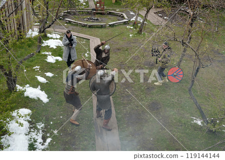 Reenacting Historical Medieval Battle in Outdoor Setting 119144144