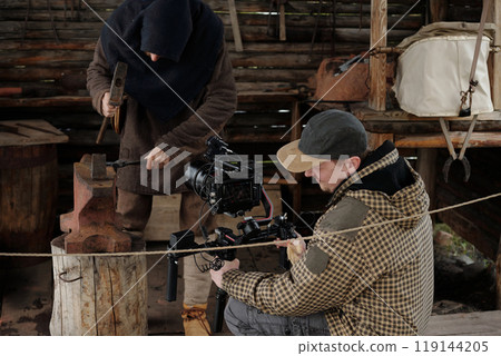 Filming Traditional Blacksmith Working in Workshop 119144205