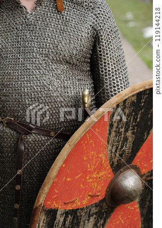 Person Wearing Chainmail Armor and Holding Shield 119144218