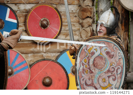 Engaging in Viking Battle Re-Enactment With Shields 119144271