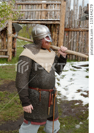 Dressed as Medieval Viking Warrior Standing Outdoors 119144279