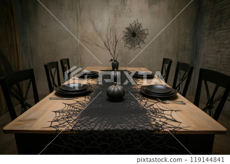 Eerie Halloween table setting with black plates, candles, spiderweb decor on dimly lit background. Spooky dining concept 119144841