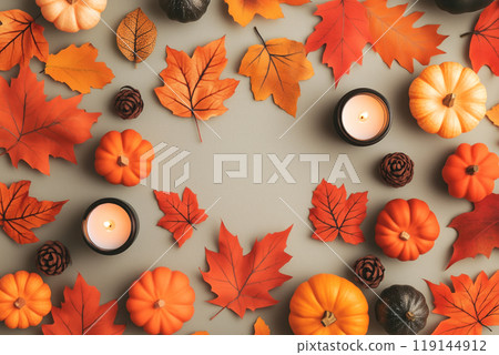 Autumn flat lay featuring pumpkins, candles, and leaves background. Concept of fall, harvest, and Halloween decoration 119144912