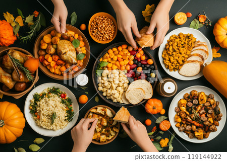 Thanksgiving dinner featuring roast turkey, mashed potatoes, stuffing, peas, sweet potatoes, greens served on table Thanksgiving dinner featuring roast turkey, mashed potatoes, stuffing, peas, sweet potatoes, greens served on table 119144922