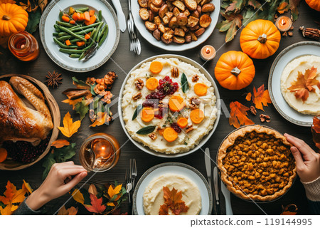 Festive table with various autumn vegetables, fruits, and dishes on white background. Concept of Thanksgiving harvest 119144995