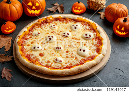 Pizza with ghost-shaped cheese toppings, black olives, and spider decorations on black background with pumpkin Halloween 119145037