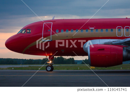 Taxiing passenger airplane in the early morning Taxiing passenger airplane in the early morning 119145741