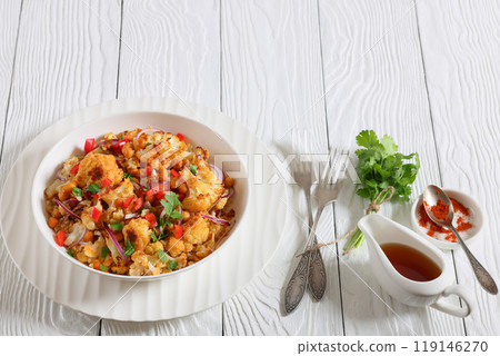 cauliflower chickpea quinoa salad in a white bowl 119146270