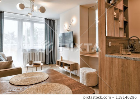 A Modern Living Room that Features Abundant Natural Light and a Cozy, Inviting Design A Modern Living Room that Features Abundant Natural Light and a Cozy, Inviting Design 119146286