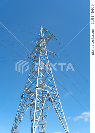 High-voltage power line support against the blue sky 119146469