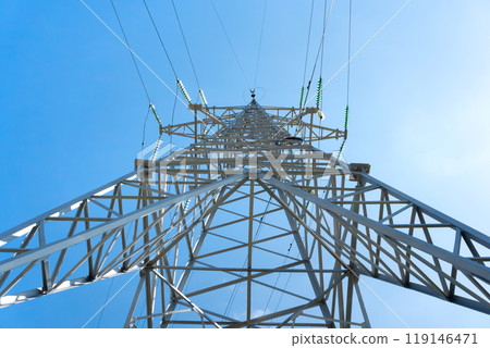 High-voltage power line support against the blue sky 119146471