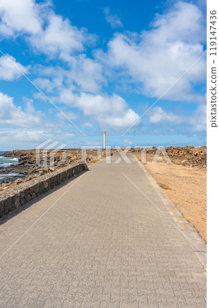 Promenade to the Faro de Punta Pechiguera lighthouse on Lanzarote Promenade to the Faro de Punta Pechiguera lighthouse on Lanzarote 119147436