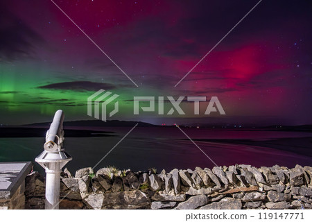 The Aurora Borealis, the northern lights, showing up in Portnoo, County Donegal, Ireland. The Aurora Borealis, the northern lights, showing up in Portnoo, County Donegal, Ireland. 119147771