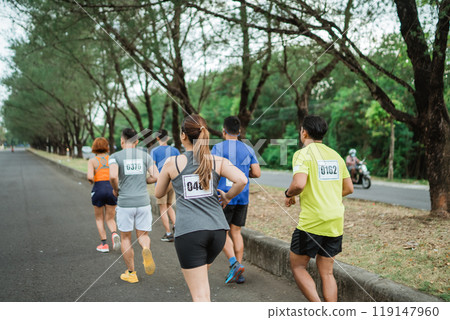 sporty people participating on marathon competition 119147960
