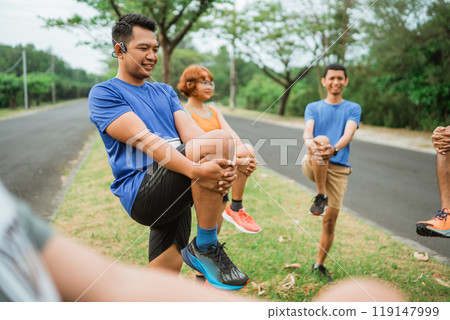 asian male runner stretching before marathon asian male runner stretching before marathon 119147999