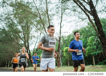 sporty man running through marathon track 119148000