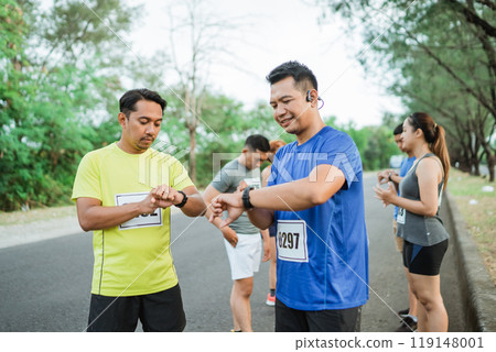 sporty runners taking a break from running 119148001