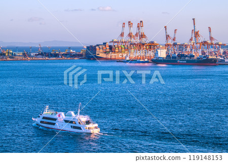 Yokohama cityscape in Japan: Restaurant ship "Marine Rouge" and container ship docked at Honmoku Pier (3rd) 119148153