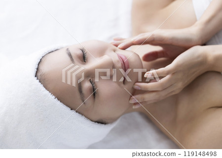 Woman taking care of her face 119148498