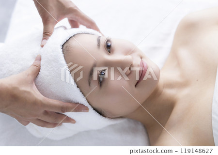 A woman getting her face done A woman getting her face done 119148627