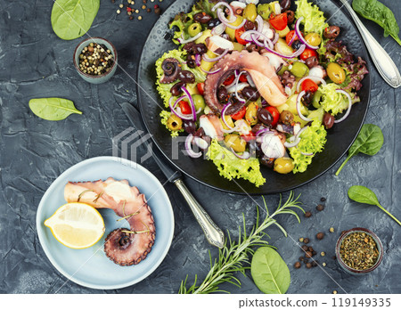 Grilled octopus with salad on a plate. Grilled octopus with salad on a plate. 119149335