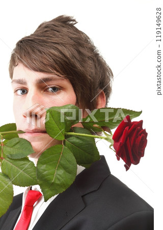 Young man, flower, red rose isolated 119149628