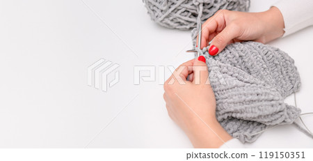 female hands knitting close up 119150351