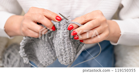 female hands knitting close up 119150355