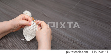 female hands knitting close up 119150361