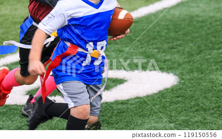 Close up of a flag football player running with the ball Close up of a flag football player running with the ball 119150556