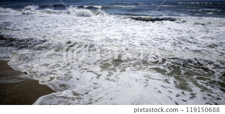 Large waves crashing down on the shores of Fire Island New York Large waves crashing down on the shores of Fire Island New York 119150688