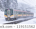 A train on the Shinetsu Main Line passing through snowy scenery 119151562