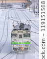 A train in Hokkaido travelling through snowy scenery 119151568