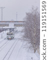A train in Hokkaido travelling through snowy scenery 119151569