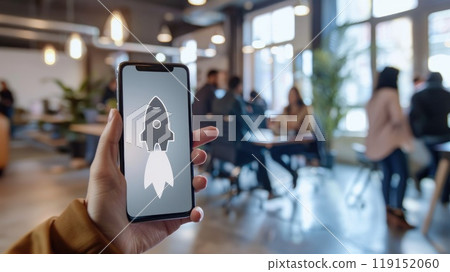 A person is holding a cell phone with a rocket on the screen A person is holding a cell phone with a rocket on the screen 119152060