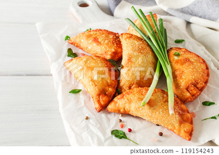 Fried chebureks, close-up, on a light background, no people, 119154243