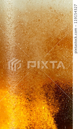Close-up of beer pouring into pint , freeze motion. 119154327