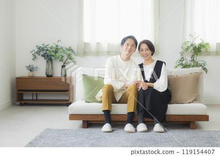 A couple in the living room A couple in the living room 119154407