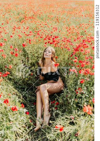 Woman poppies field. portrait happy woman with long hair in a poppy field and enjoying the beauty of nature in a warm summer day. 119156312