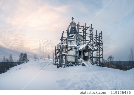 Old church in scaffolding. All covered with snow. Old church in scaffolding. All covered with snow. 119156486