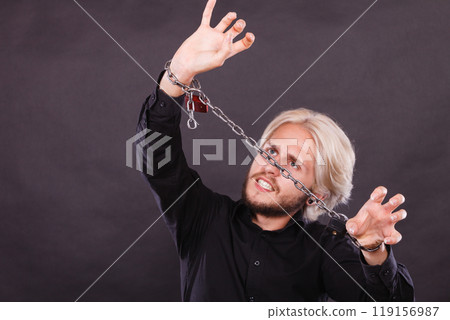 Furious man with chained hands, no freedom Furious man with chained hands, no freedom 119156987