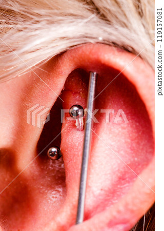 Pierced man ear, black plug tunnel, industrial and rook 119157081