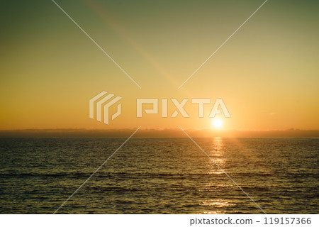 Sunset or sunrise over sea surface 119157366