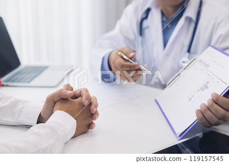 A doctor consulting and explain patient health check in office. Medicine and health care concept. A doctor consulting and explain patient health check in office. Medicine and health care concept. 119157545