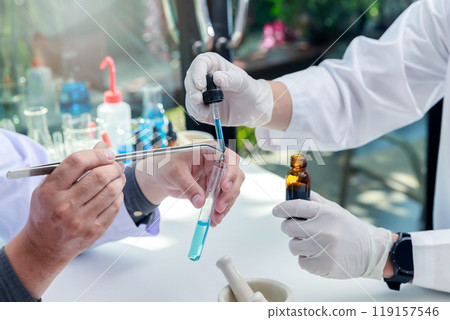 Team of researcher or scientists working in laboratory. Researcher or scientists working in laboratory. Researchers are inventing vaccines or medicine to treat COVID-19 virus. 119157546