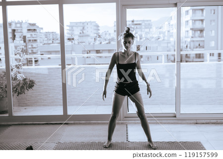 Dynamic Dance Pose Captured Beautifully in a Natural Light Setting That Inspires Awe Dynamic Dance Pose Captured Beautifully in a Natural Light Setting That Inspires Awe 119157599