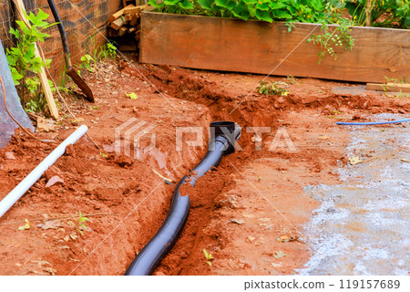 An open trench is dug for the purpose of laying drainage pipes for stormwater 119157689