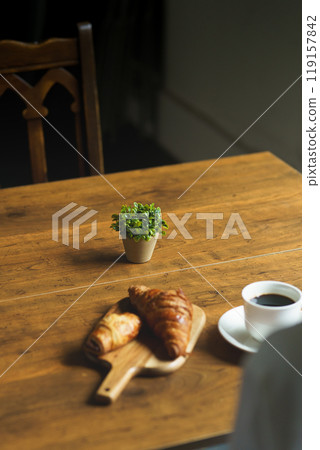 Young woman drinking a cup of coffee in a calm atmosphere in the morning 119157842