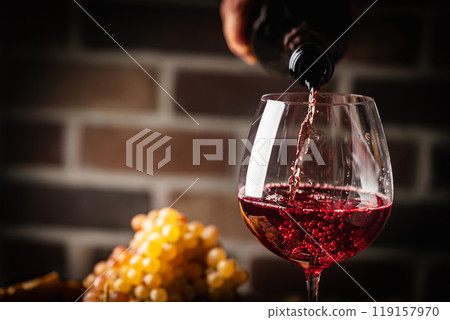 Pouring red wine 119157970