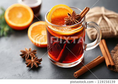 Glass of mulled wine garnished with orange slices, cinnamon sticks, star anise Glass of mulled wine garnished with orange slices, cinnamon sticks, star anise 119158139